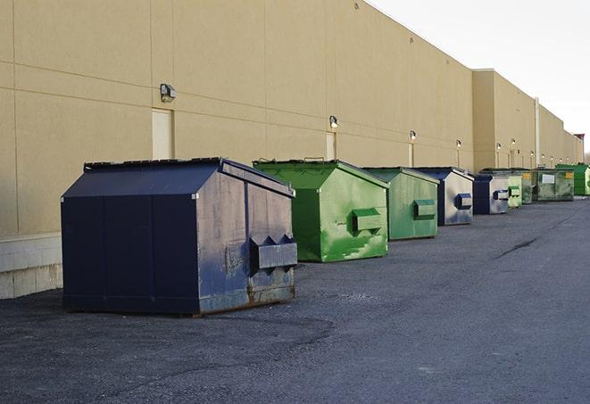 red and green waste bins at a building project in Cerrillos